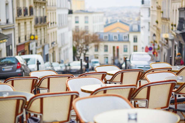 Chairs at an empty cafe in the Montmartre district of Paris.