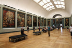 Load image into Gallery viewer, A sunlit gallery inside the Louvre museum.

