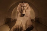Load image into Gallery viewer, A large Egyptian statue inside the Louvre.
