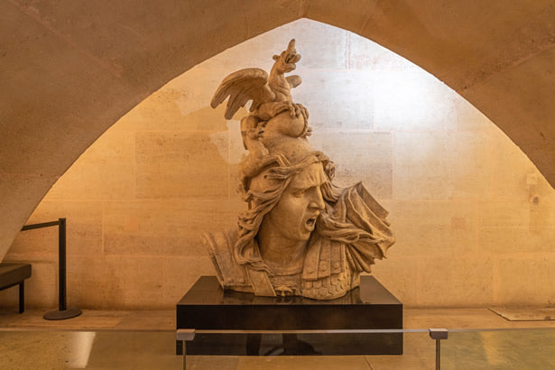 "The Genius of War" statue inside the Louvre museum in Paris, France.