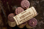 Load image into Gallery viewer, A cork from a bottle of 2009 Bordeaux wine.
