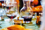 Load image into Gallery viewer, Bordeaux wine in glasses on a table.
