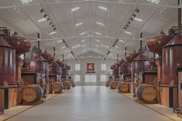 Large cognac distilling casks at Hennessy in Cognac, France.