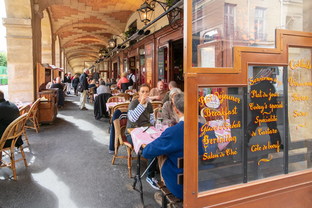 Diners in the charming Marais district of Paris.