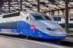 Load image into Gallery viewer, A TGV train bound for the city of St. Malo sits at Gare Montparnasse in Paris.
