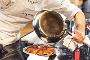 A Ferrandi chef inverts a tarte tatin onto a serving platter